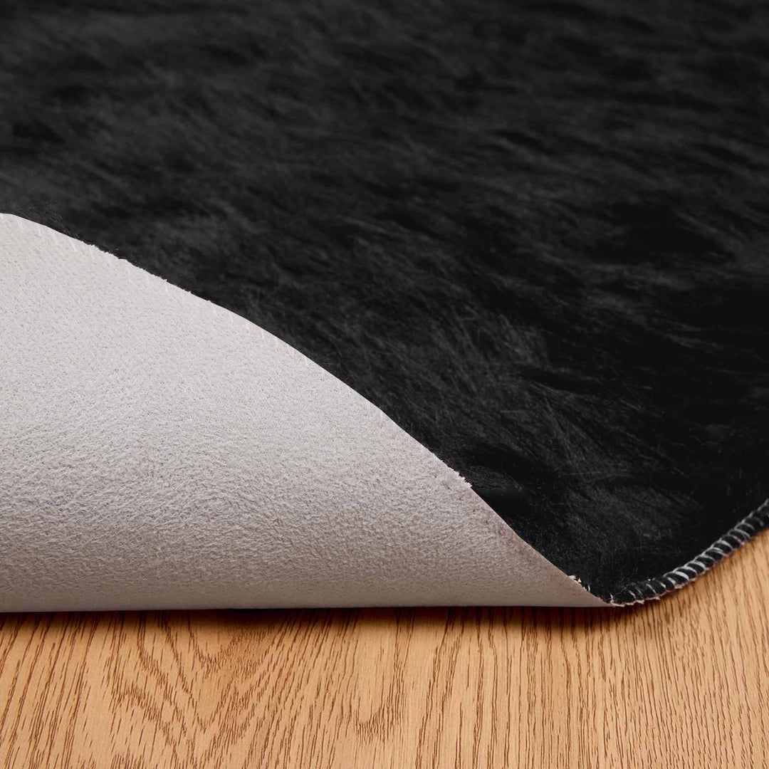 Fuskobbel lammeskindstæppe TAFALLA Sort Ø 120 cm Polyester