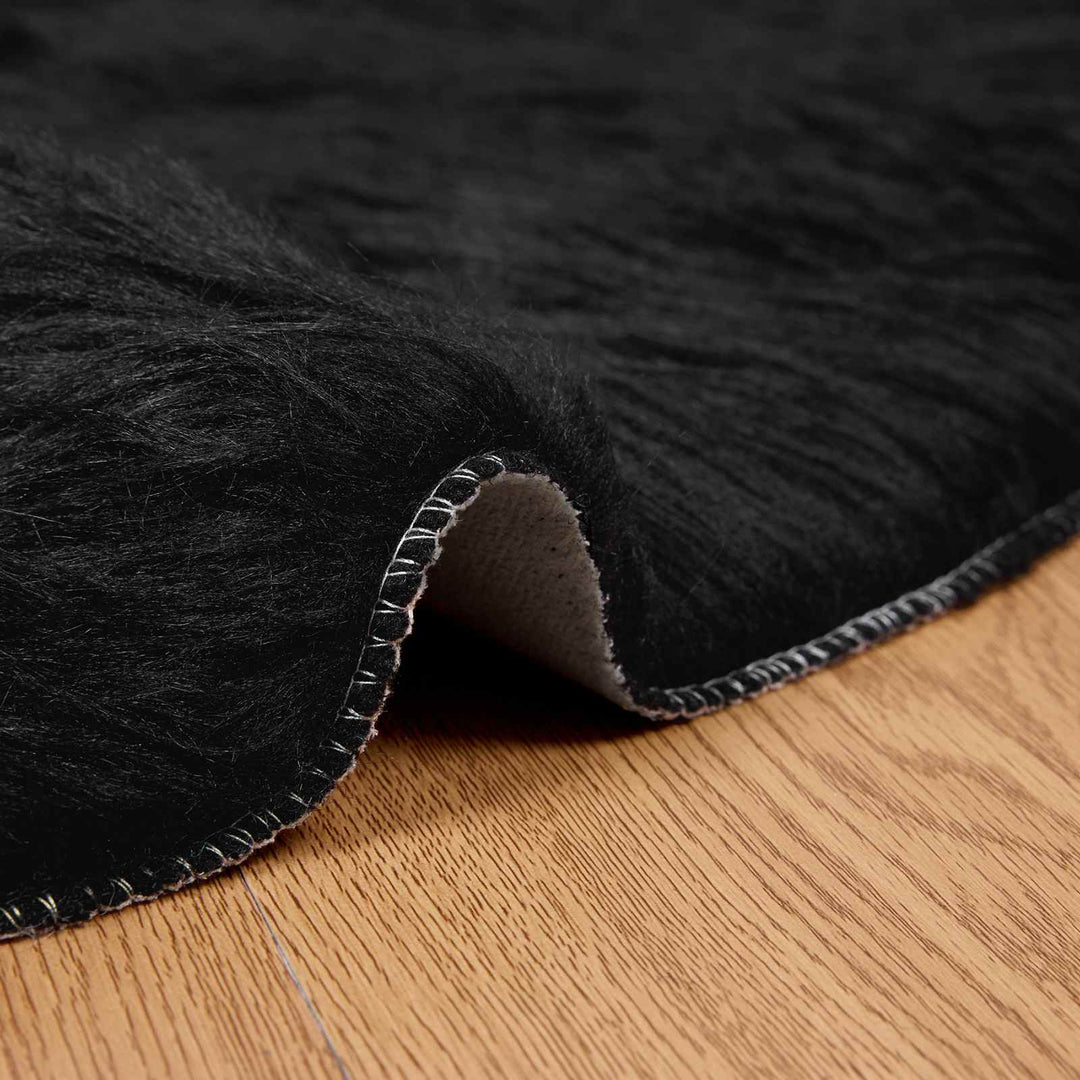 Fuskobbel lammeskindstæppe TAFALLA Sort Ø 160 cm Polyester